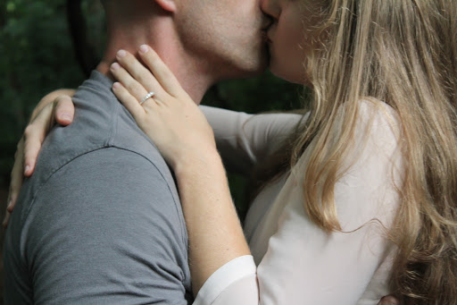 couple intimately kissing